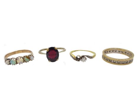 18ct gold diamond ring, gold garnet ring, gold opal ring and a stone set eternity ring, all 9ct stamped or tested - Condition