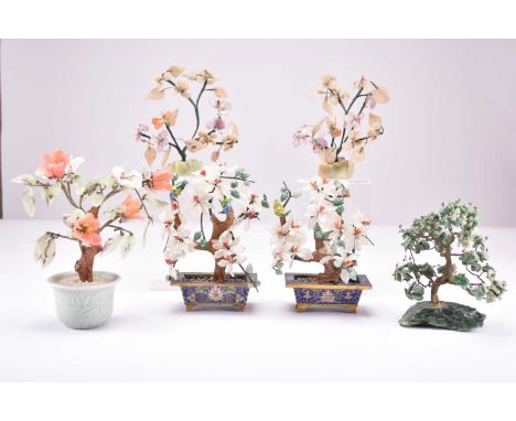 A collection of six Chinese hardstone models of trees, 20th centuryIncluding a pair within cloisonne planters, one in a celad