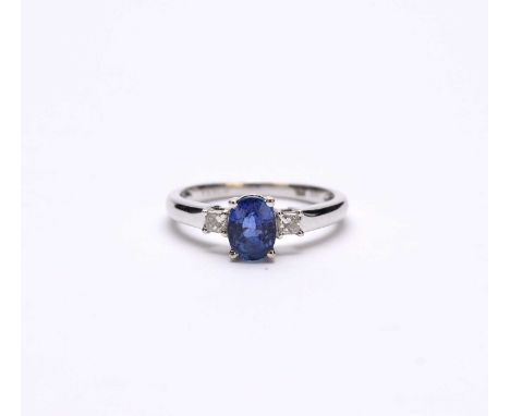 An 18ct white gold three stone sapphire and diamond ring, size O, weight approx 3.3g