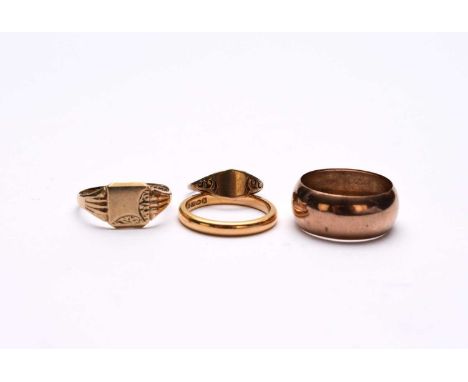 A 22ct gold wedding band, size M 1/2, weight approx 4.3g, together with a 9ct gold signet ring, size Q, a broad 9ct gold band