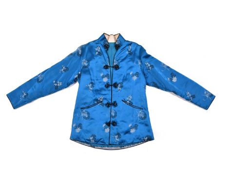 A Chinese brocaded silk short winter jacket, 20th centuryThe mid blue silk patterned with black and silver scattered flowers 