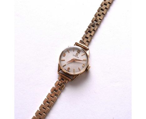 Omega: A lady's 9ct gold bracelet watchDate: 1961Movement: Cal.245 17-jewel, manualDial: Gold brushed, gold baton and Arabic 