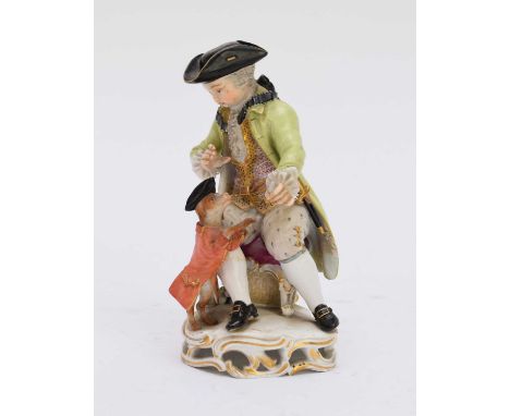 A Meissen porcelain figure of a boy playing tricks with a dog19th centurymodel B94, modelled seated on the stool, the dog dre