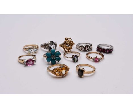 A collection of stone set rings, comprising; two 9ct gold citrine and diamond rings, both size P, a 9ct gold cabochon ring, s