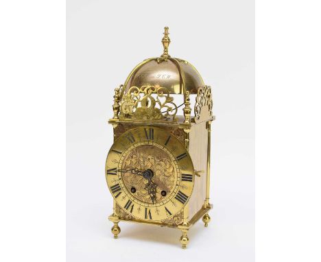 An early 20th century reproduction brass lantern clock, of typical form with brass Roman chapter ring and Winterhalder &amp; 