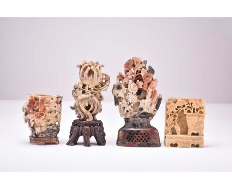 A group of four Chinese soapstone carvings, first half 20th centuryOf light ochre and grey hue with russet inclusions, modell