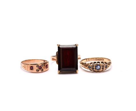 An 18ct gold sapphire and diamond ring, size R, together with a ruby and diamond ring, not stamped, size K and a red stone se