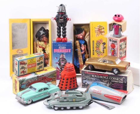 Collection of mixed tinplate, plastic toys, and models, including a Tomy Dalek in red, Pelham Puppet "Witch", Trad Toys plast