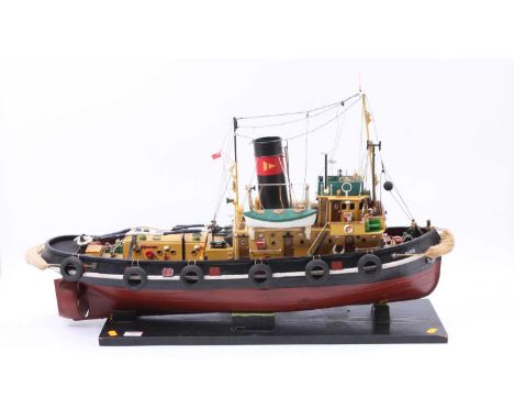 A wooden and GRP hulled radio-controlled model of a single propeller Tug Boat named Alice, finished in red, black and white w