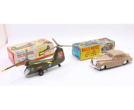 A boxed Marx Toys clockwork mechanical Army Air Transporter Helicopter comprising of a green body with 2 pilot figures and tw