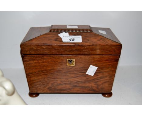 A Victorian rosewood sarcophagus shaped tea caddy 