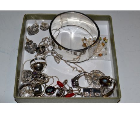 A silver ingot pendant ; a silver George VI threepenny bit necklace ; a pair of marcasite ear studs, conforming ring and pend