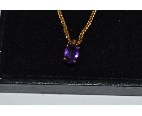 A 9ct gold and amethyst pendant