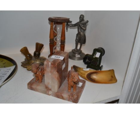 Ephemera - a horn ashtray and pipe holder; a spelter taper holder; a pair of marble bookends; a treen egg timer; a carved cow