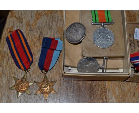 World War II - a set of four medals, Defence, Burma sTAR, 1939 - 1945 Star;  War medal;  Army Prayer book;  black and white p