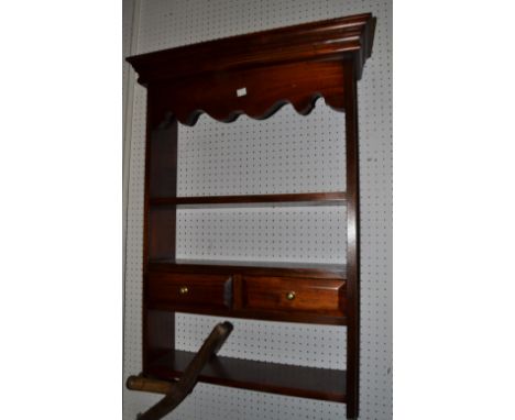 A 20th century wall hanging shelf, single open shelf, over two drawers