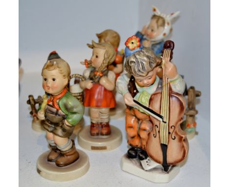 A Goebel figure, modelled by MJ Hummel, Tooth Ache Boy;  others, School Girl, Farmyard Hero;  Wayside Harmony;  Little Shoppe