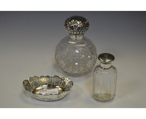 Silver - an Edwardian silver topped globular dressing table scent bottle. Sheffield 1911; another oval;   an oval trinket bow