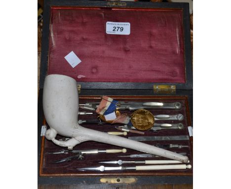 An unusually large tobacconist advertising pipe c 1870; 2 commemorative medallions; a 19th Century rosewood drawing instrumen