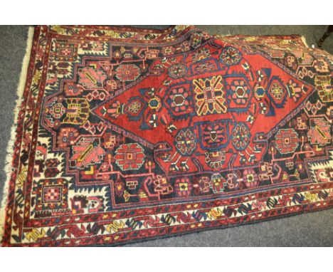 A vintage Persian Brojerd rug 193cm x 128 cm
