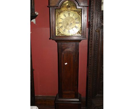 A George III oak longcase clock of small proportions with brass face bearing the name Joseph Ren, Wivells Combe. This clock i
