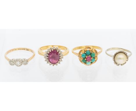 Three 18ct Gold Rings and a 9ct Gold Three-Stone Melee Round Brilliant Cut Diamond Ring. To include an 18ct Gold Ruby and Dia