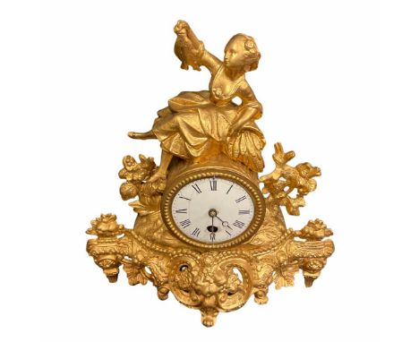 A French gilt spelter mantel timepiece, having an eight-day duration timepiece movement, the white enamel dial with black Rom