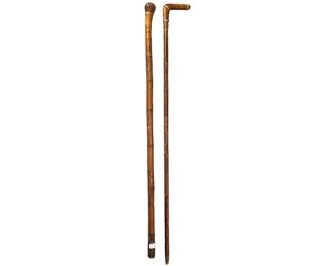 An early 20th century gold banded walking stick by Dupuy, 89cm long and a Japanese bamboo carved folk art walking stick, 86cm