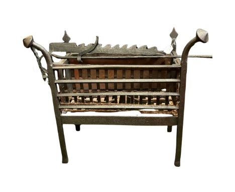 An 18th century wrought iron grate with outcurved finials and on square legs, 65cm high x 69cm wide x 31cm deep and an early 