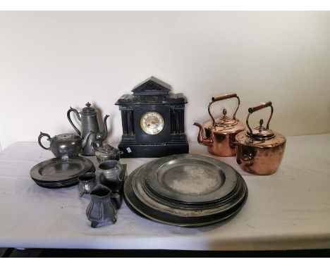 A collection of antique pewter chargers and plates as well as other pewter items. Together with a Victorian slate mantle cloc