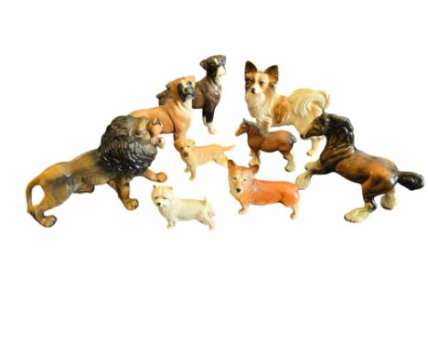 A collection of ceramic animals. 9 items Mostly unmarked. lion missing a tooth.