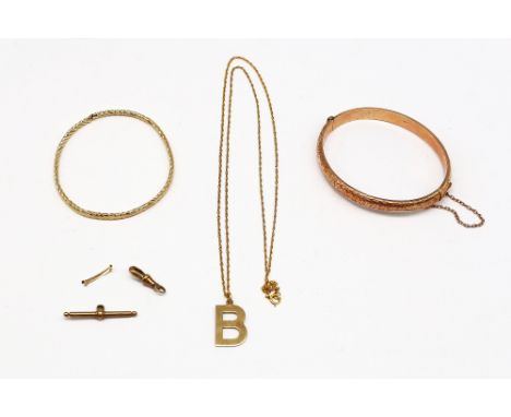 A selection of 9ct Gold Jewellery. To include a 9ct Rose Gold Patterned Bangle with safety chain. (Dents in the Bangle). Tota