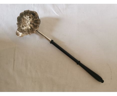A Georgian silver single spouted punch ladle with later turned wooden handle. Hallmarked to the inside of the bowl for: 'Lond