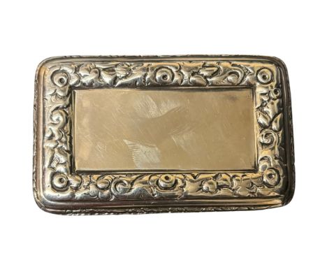 A Victorian silver rectangular snuff box, maker E.E., London 1842, with engine turned decorationchased floral border, gilt in