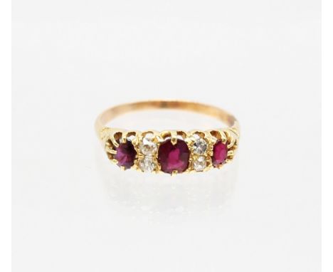 Unmarked Yellow Metal Oval Brilliant Cut Ruby &amp; Old European Cut Diamond Ring
The Ring contains three Oval Brilliant Cut 