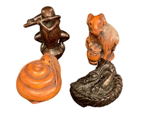 Four modern carved wood netsukes, ram, frog playing the flute and snake all signed and a coiled dragon netsuke&nbsp; (4)