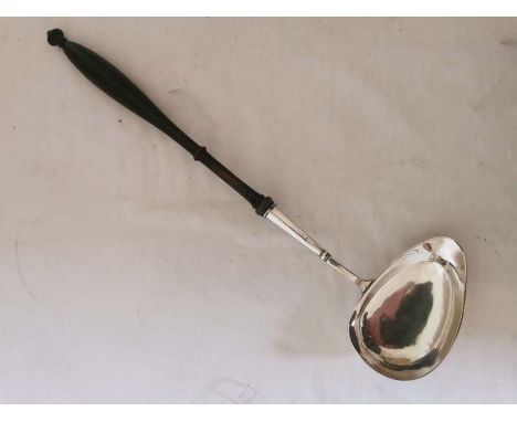 A Swedish silver single spouted punch ladle with turned wooden handle. Hallmarked to the outer rim of the bowl for 1845. 41cm