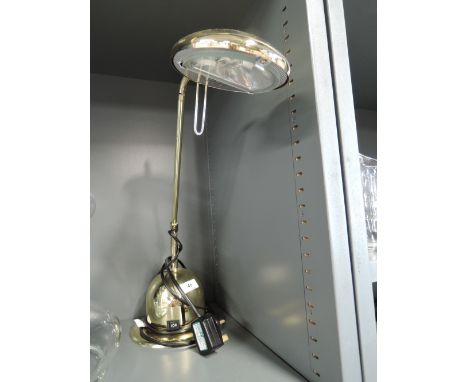 A brass effect reading light