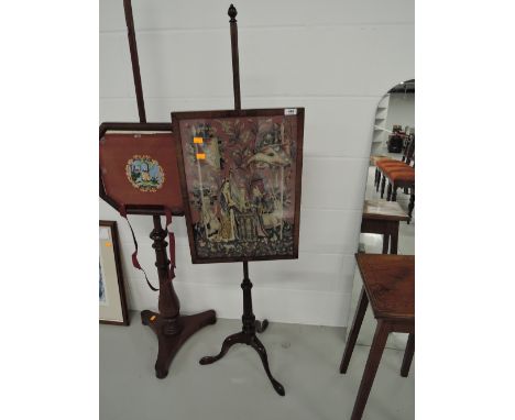 A 20th century mahogany frame pole screen in the period style having inset woolwork tapestry on adjustable pillar and triple 