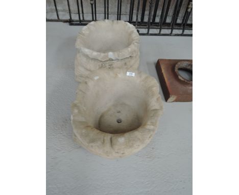 Two large concrete planter in the form of a sack