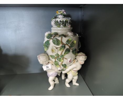 A vintage ceramic table centre in a meissen style 