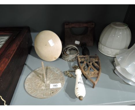 A miscellaneous selection including flat iron trivit, darning mushroom, sundial, ceramic toilet pull etc