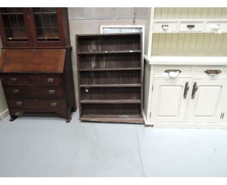 A stained pine shelf and mirror