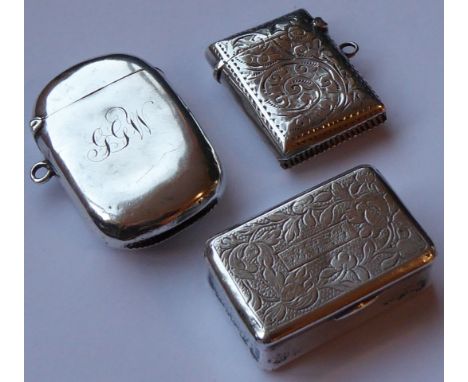 ADDED LOT    A silver and white metal group to include early 20th Century foliate engraved rectangular vesta, one further sli