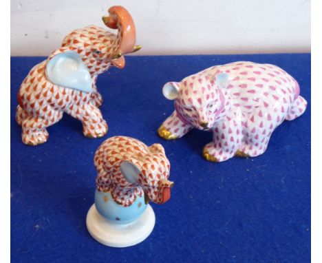 Herend porcelain, a group of three animals to include two elephants and a prowling bear CONDITION REPORT: The pieces are not 