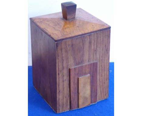 An Art Deco style elm box and cover, the front with geometric-style applied panels, 22cm high (including finial) 