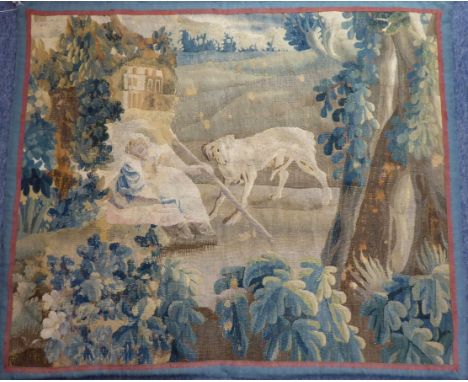 A 17th Century French wall hanging tapestry depicting a rural scene with sleeping shepherdess and attendant dog within countr