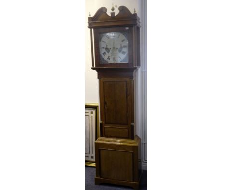 A 19th century oak and mahogany-crossbanded eight-day longcase clock; the broken swan-neck pediment surmounted with a central