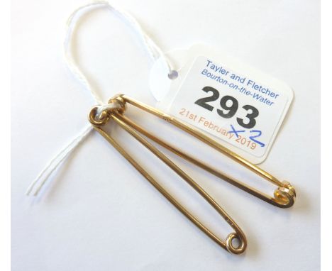 A 9-carat yellow gold stick pin, approx. 3.38g; together with one further 15-carat example, approx. 4.38g