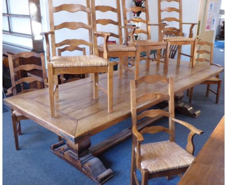 A magnificent dining table and ten-chair set;  the large (310cm x 110cm) table plank-topped (fruitwood/walnut?) with angular 